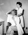 Rita feigns getting her hair cut for the film by Columbia's cheif hair stylist, Helen Hunt
